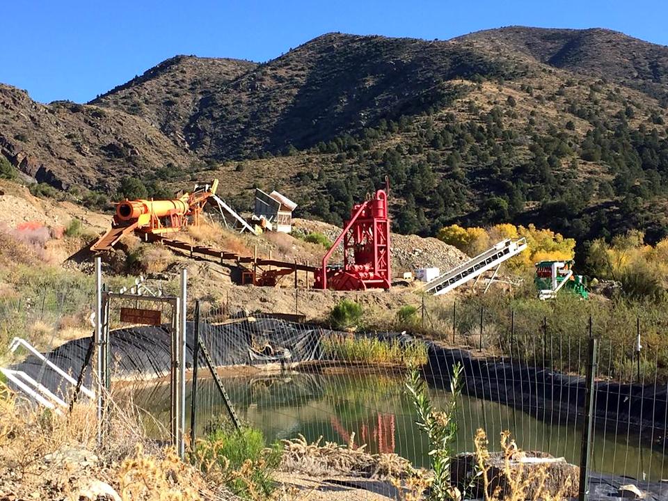 Plant, conveyor and ponds below the hills